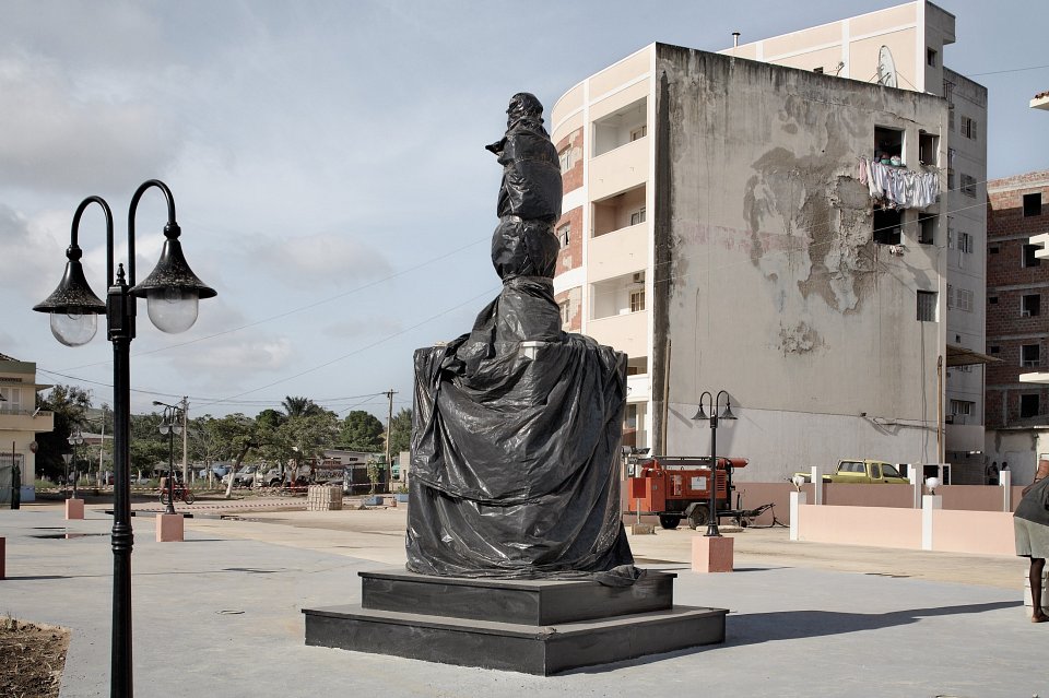 New town square with wrapped statue of Agostinho Neto, Sumba, Angola, 2008